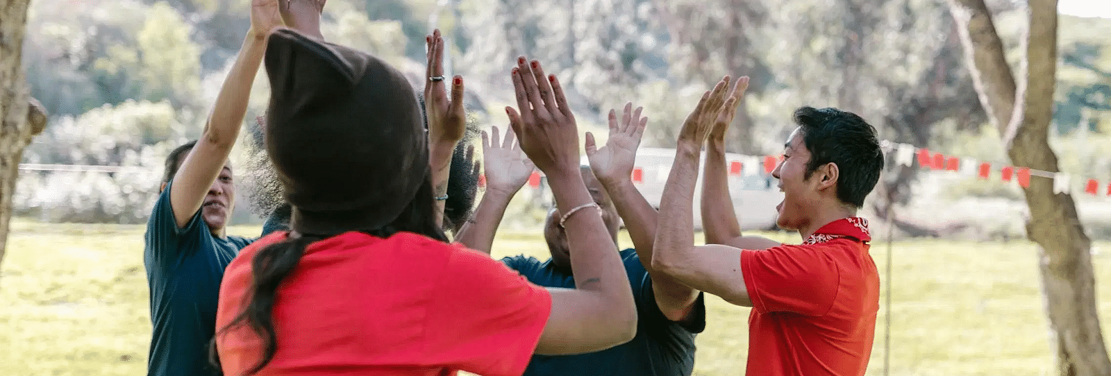A group of people giving each other a high-five.