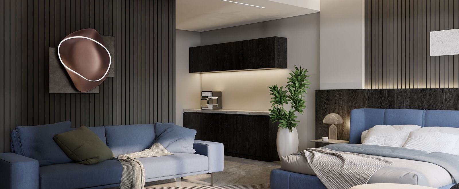 A spacious suite featuring a bed, blue sofa, sleek lighting, and an open-concept living space at Town Square Suites.