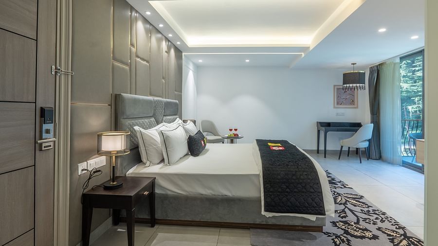 an image of a premier room with a balcony at Mastiff Select Mandavya Dharamkot, McLeodganj