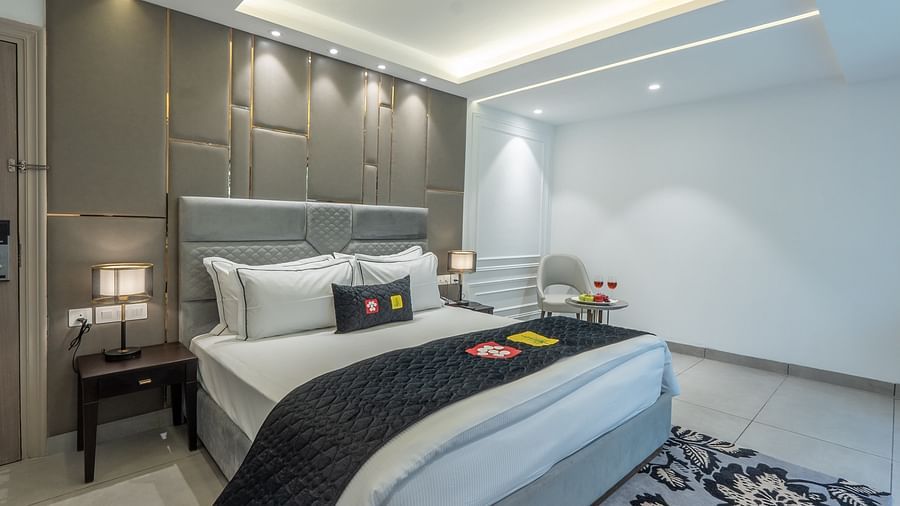 an image of a premier room with a fancy square ceiling illuminating lights at Mastiff Select Mandavya Dharamkot, McLeodganj