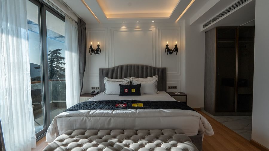 an image of a suite with  balcony space at Mastiff Select Mandavya Dharamkot, McLeodganj