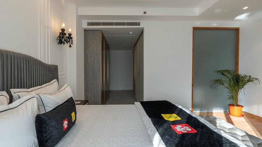 an image of a  bedroom with sunlight streaming through the windows on the bed at Mastiff Select Mandavya Dharamkot, McLeodganj