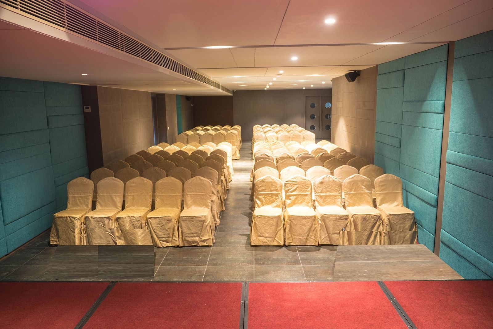 event halls white chairs at Cholaa Dynasty, Kumbakonam