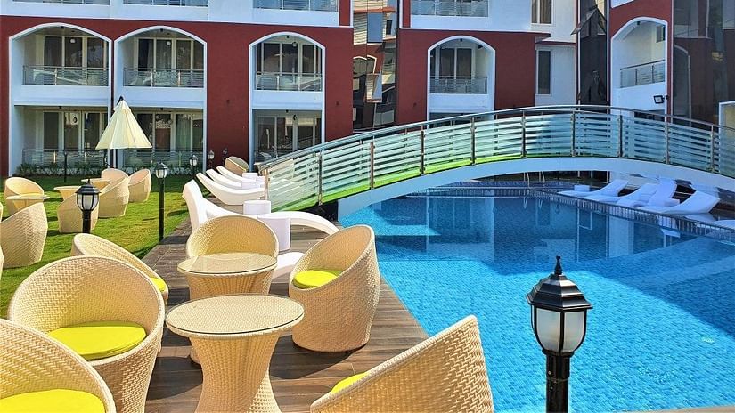 seating arrangements next to the swimming pool - VITS shanti solitaire, North Goa