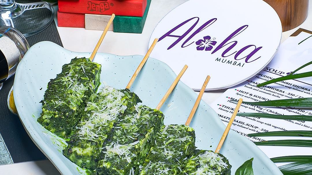 Herb marinated paneer skewers with salad garnish served at Hotel Mumbai House Mindspace, Malad.
