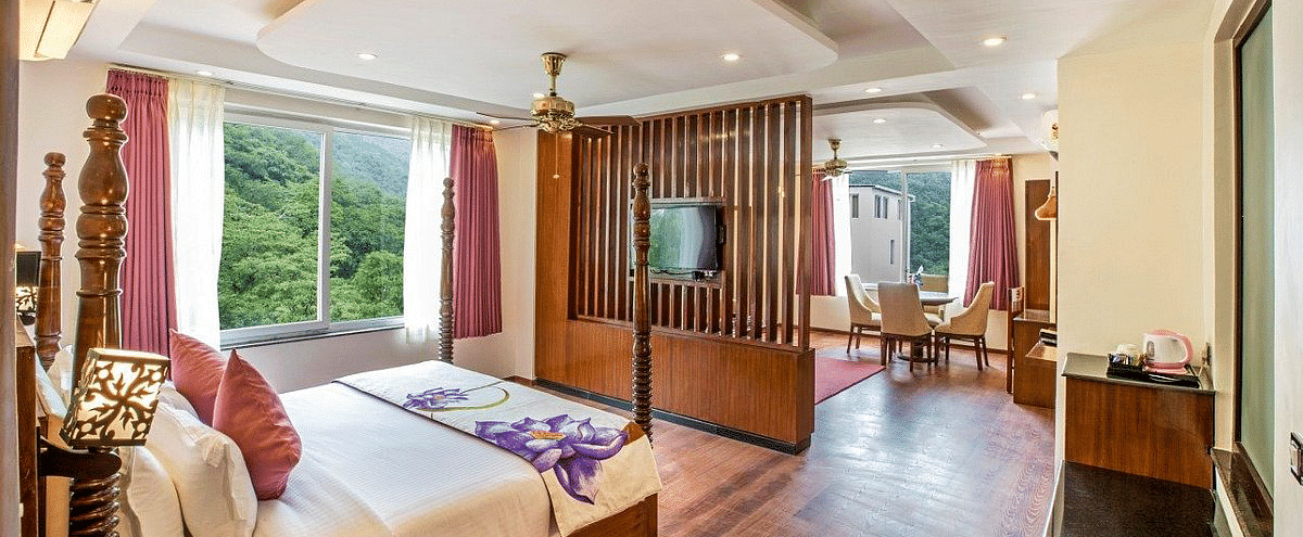 Corner view shot of the Suite with ample of natural light coming from the windows at Regenta Inn DLS.