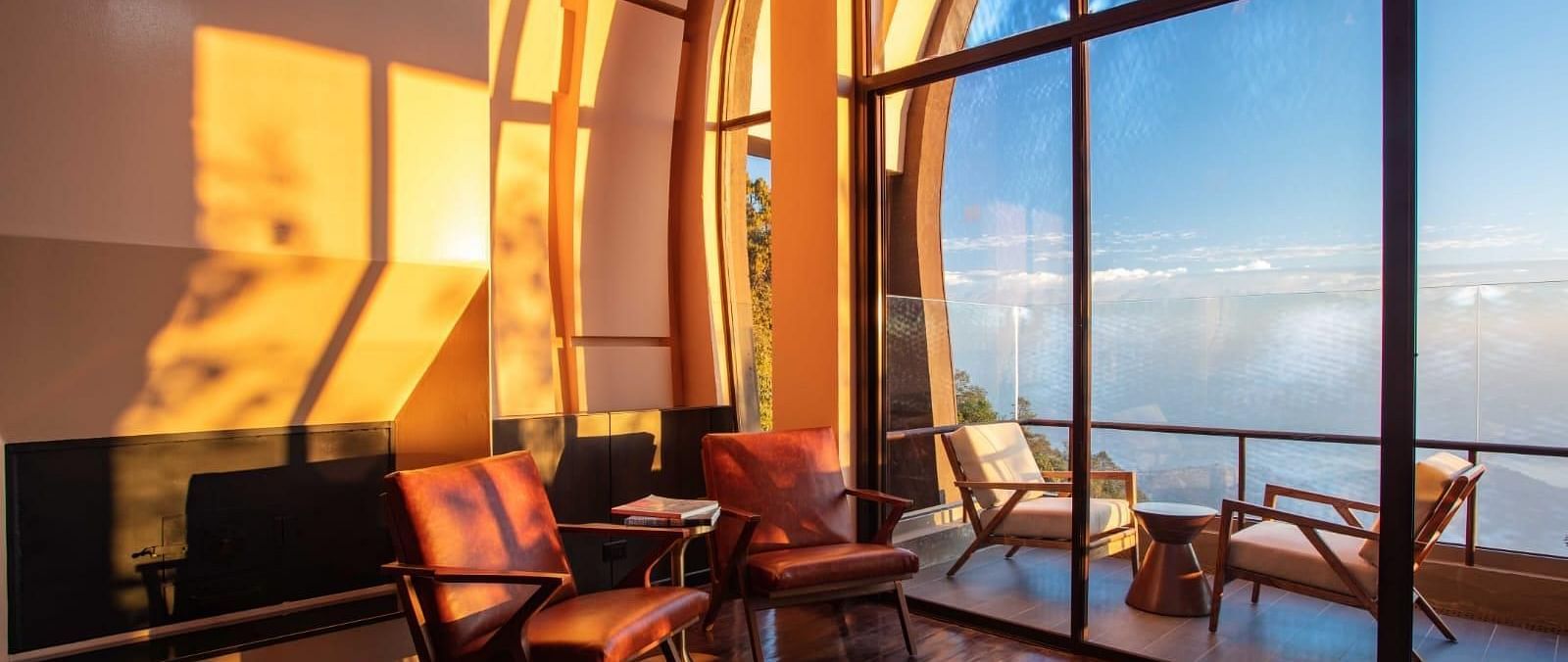 Sunlight gleaming into the room that has huge glass windows | Kavya Resort & Spa, Nagarkot