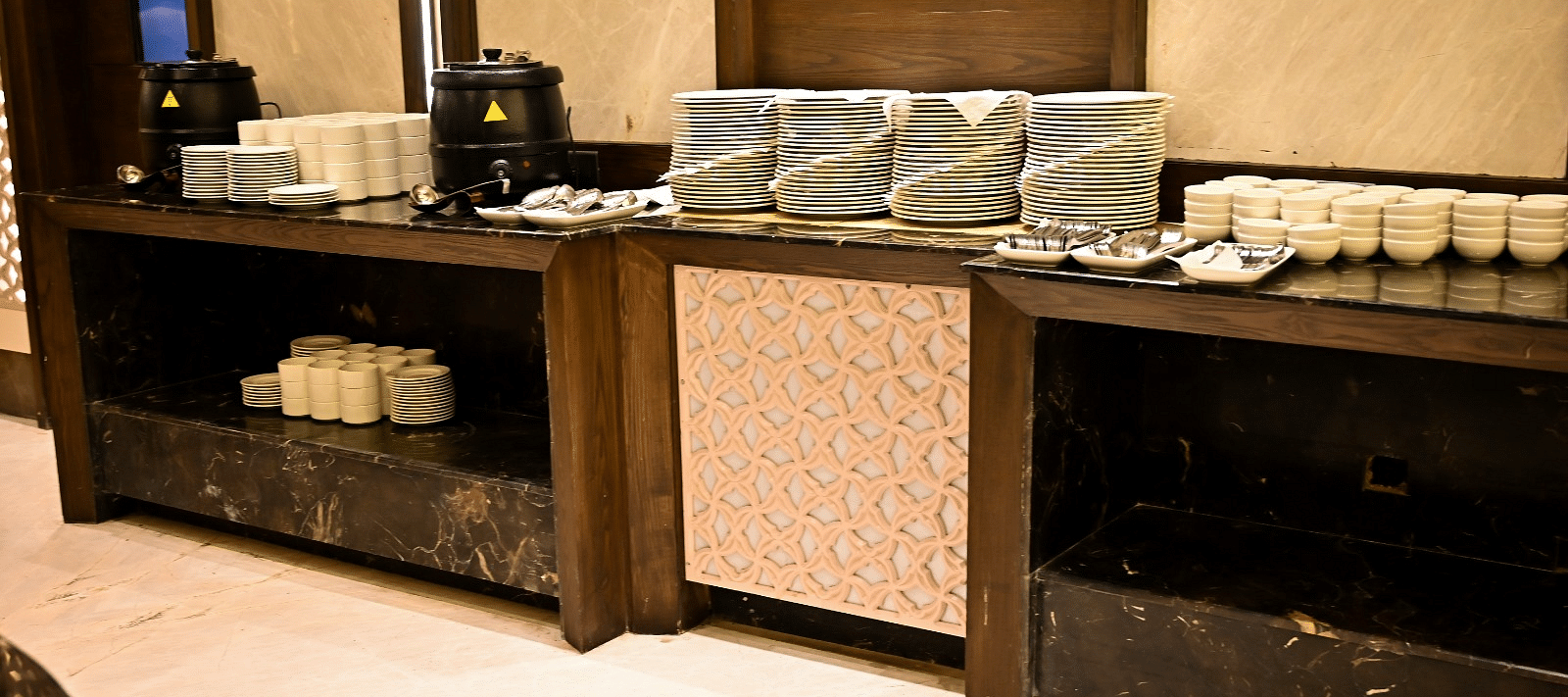 Cutlery elegantly arranged on a rustic wooden table at BluSalzz Residence, Amritsar