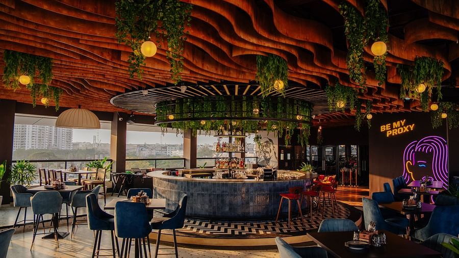 Sophisticated restaurant setting with panoramic city views and natural light. | The Icon Select by Bhagini, Mahadevapura