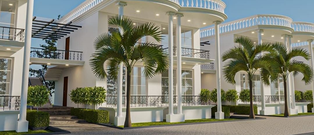 Corner view of a building with tall pillars supporting the roof from the ceiling.