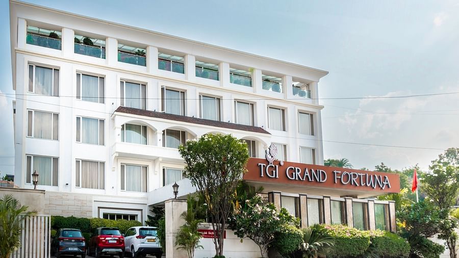 Angled exterior view of The Grand Victoria hotel with prominent signage- TGI Grand Fortuna, Krishnagiri Main Road, Hosur