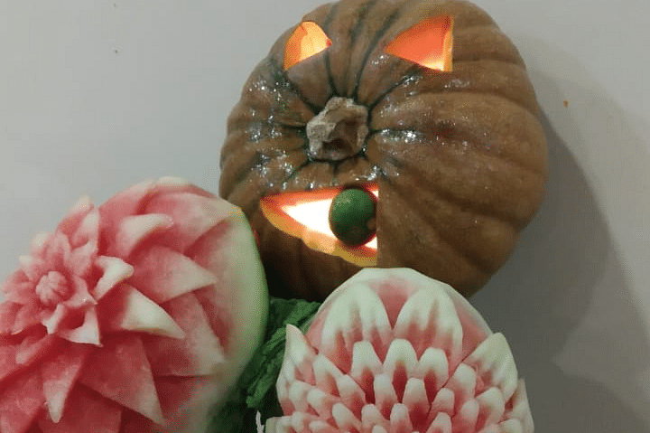 Another fruit carving display showcasing artistic floral designs on vegetables at Central Courtyard Boutique Hotel.