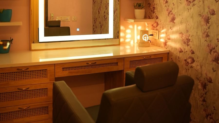 a single chair in front of a mirror with led lights - IOSIS Spa & Wellness