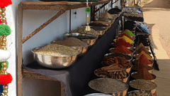 An overview of a street vendor's place with many spices for sale in the streets of Goa