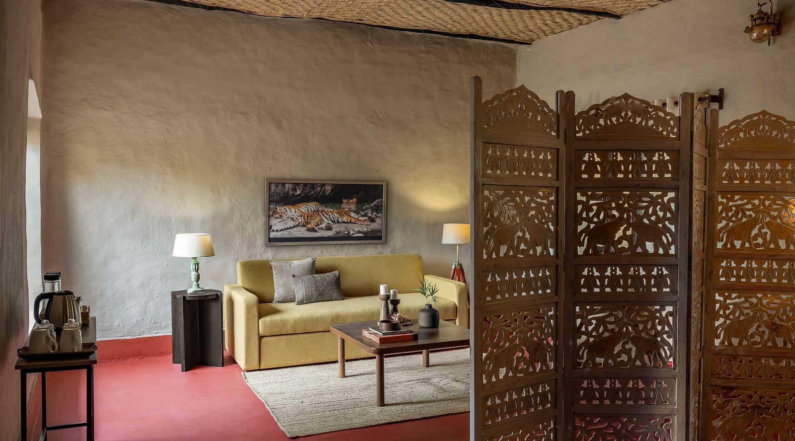 Living room in Mud House Suite at Saccharum Safari Lodge, Balaghat