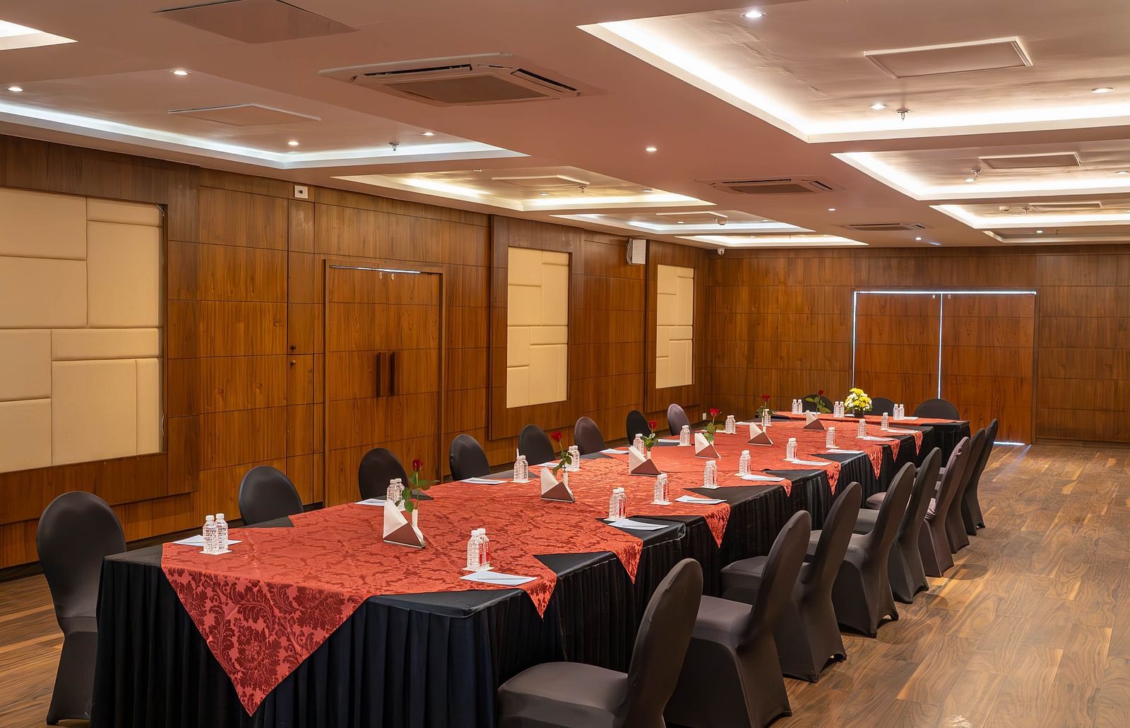 A long conference room with a table and chairs on either side - Bamboo Saa Resort & Spa, Udaipur