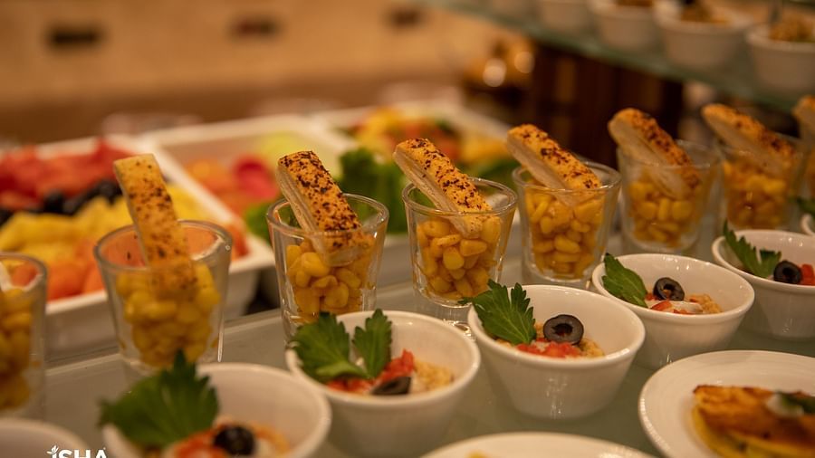 A close-up shot of beautifully plated food at The Gaurs Sarovar Premiere, ready to be served in the dining area.