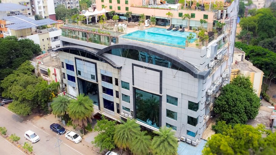 An aerial view of Hotel Ashok Nagpur, featuring a modern building with greenery surrounding it. 