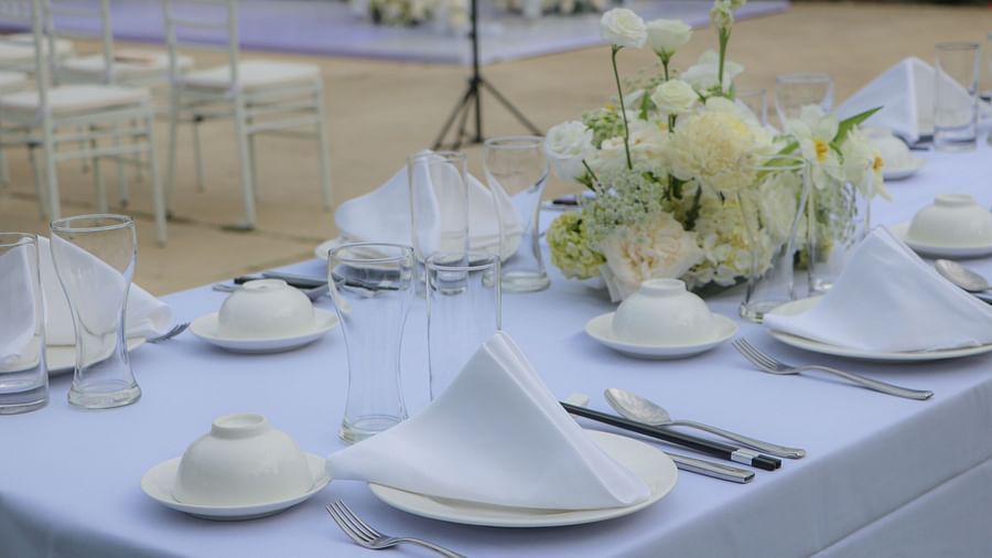 An image of a a table decorated by flowers  - Alibu Resort Nha Trang