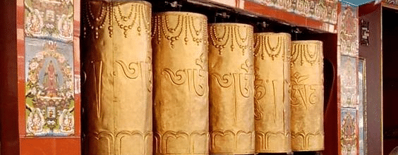 Traditional prayer wheel used in spiritual practices.