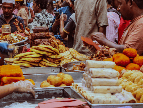 Kolkata street food vendors serving popular local snacks in a busy city market.