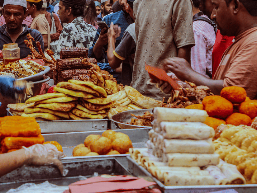 Kolkata street food vendors serving popular local snacks in a busy city market.
