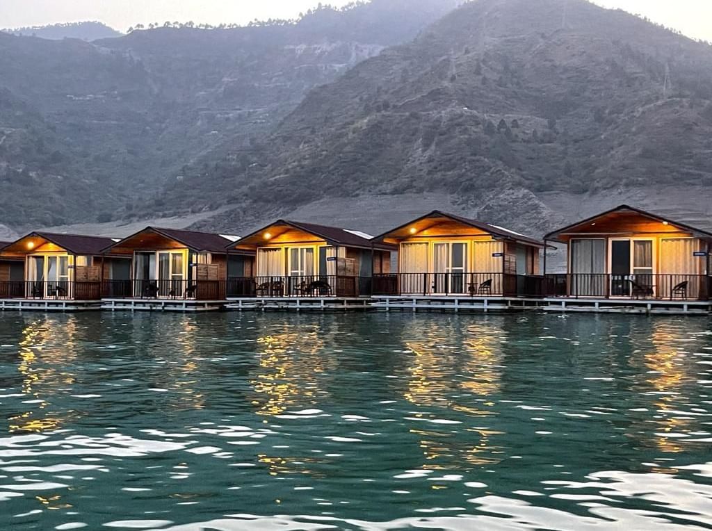 ariel and front view of the floating huts at Le ROI Floating Huts Eco Rooms captured during the day and at night10