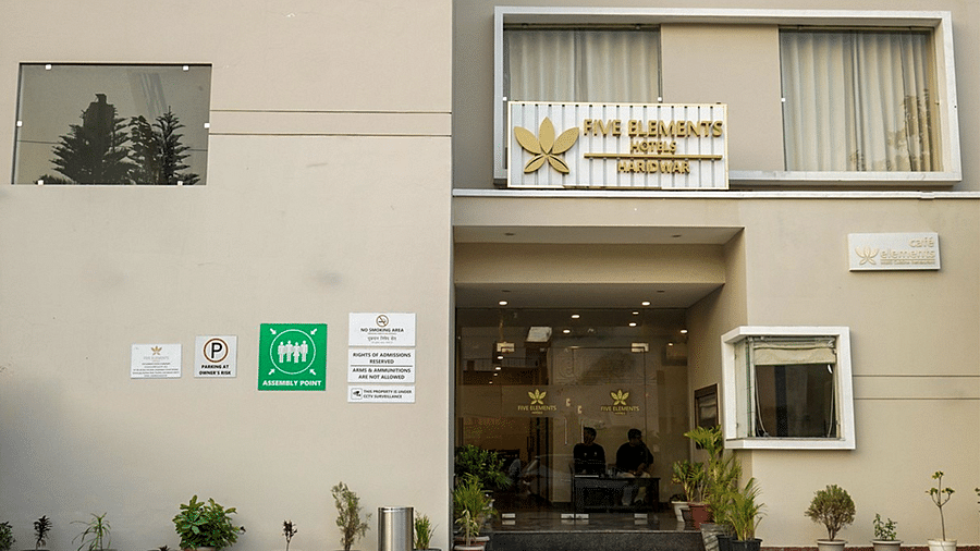 Facade of Five Elements Hotels, Haridwar, highlighting the entrance and corner wall signboards