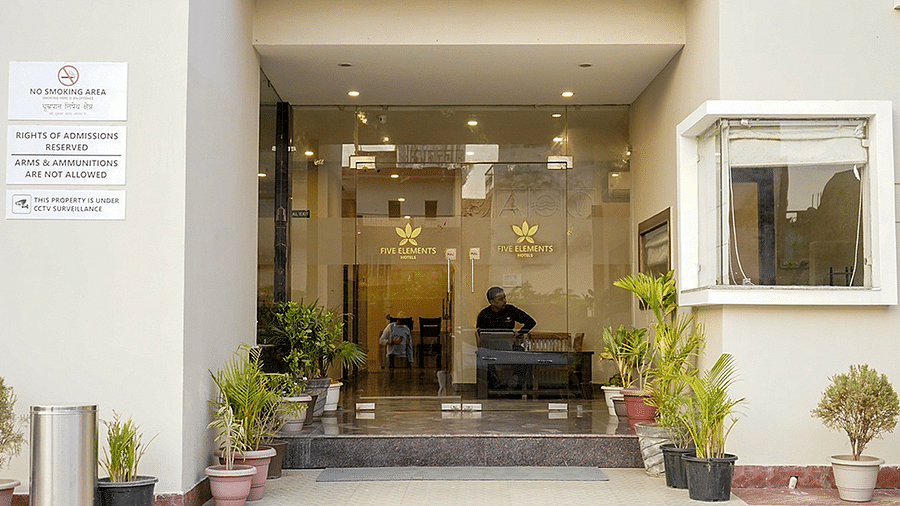 Entrance of Five Elements Hotels, Haridwar, with a plant pots placed at the entryway