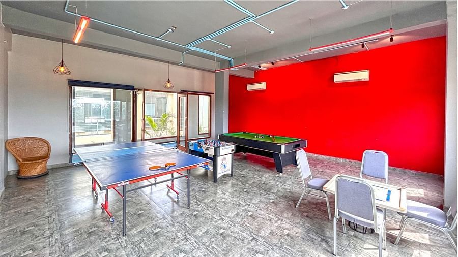 A spacious games room featuring table tennis, carrom, and a pool table, set up at DLS Forest Vines Resort & Spa, Ramnagar (Jim Corbett).