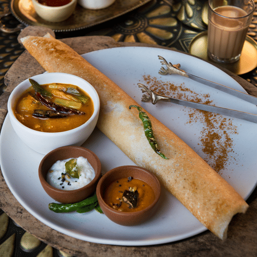 South Indian Dosa served with Sambhar, Coconut as well as Garlic Sauce