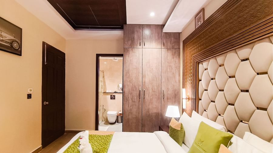 Luxury Junior Suite at The Meriton, New Delhi with modern décor and cozy seating area