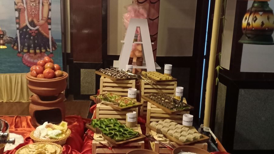 Food stacked on a table with a letter A on top at SRM Hotel Tiruchirappalli- Hotel 