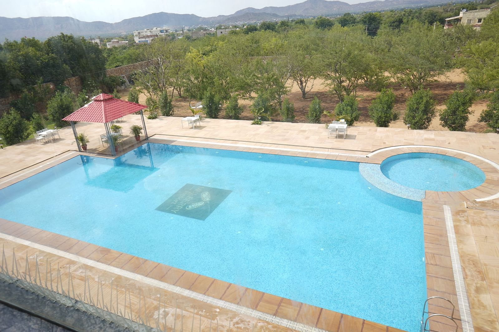 An aerial view of a swimming pool at the Bamboo Saa Mulberry Resort, Pushkar.