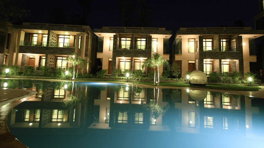 Resort cottages overlooking a swimming pool