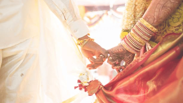 Bride and groom holding hands - Hablis Hotel, Chennai