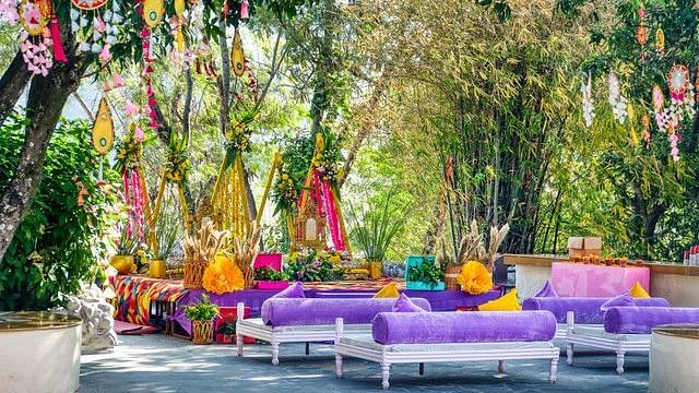 alt-text Relaxing seating area with colorful cushions and pillows.