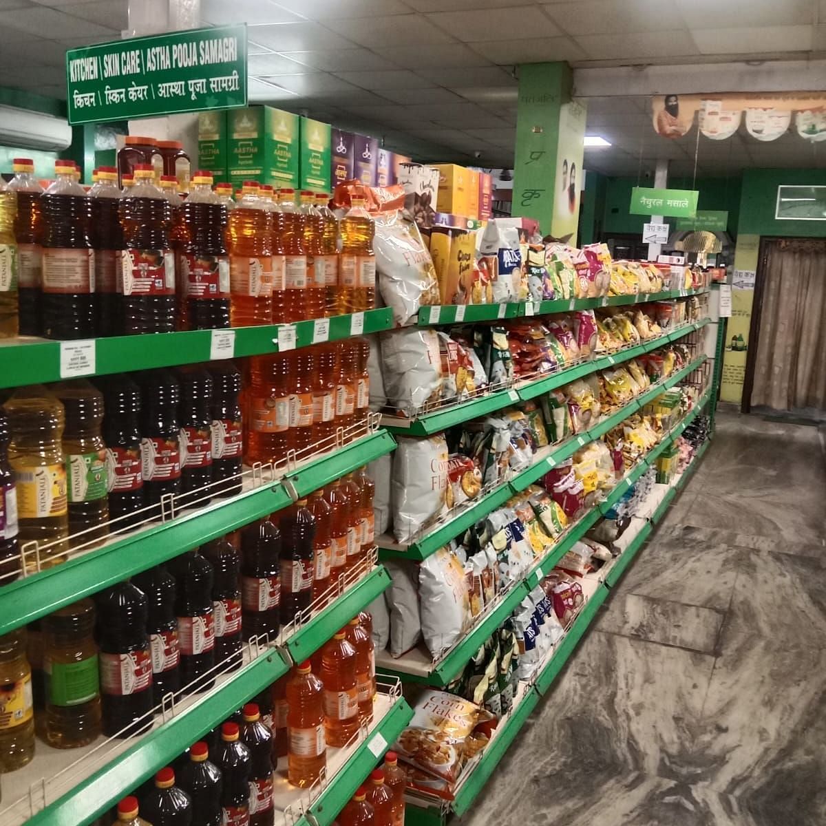 Close-up of shelves in a Patanjali Megastore displaying an assortment of supplies and household goods.