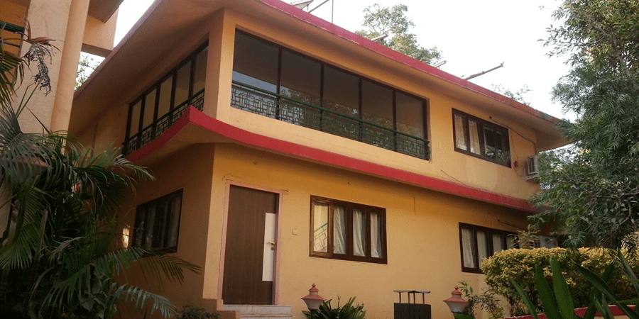 An exterior view of the two floor bungalow of the resort, of of their accommodation options.