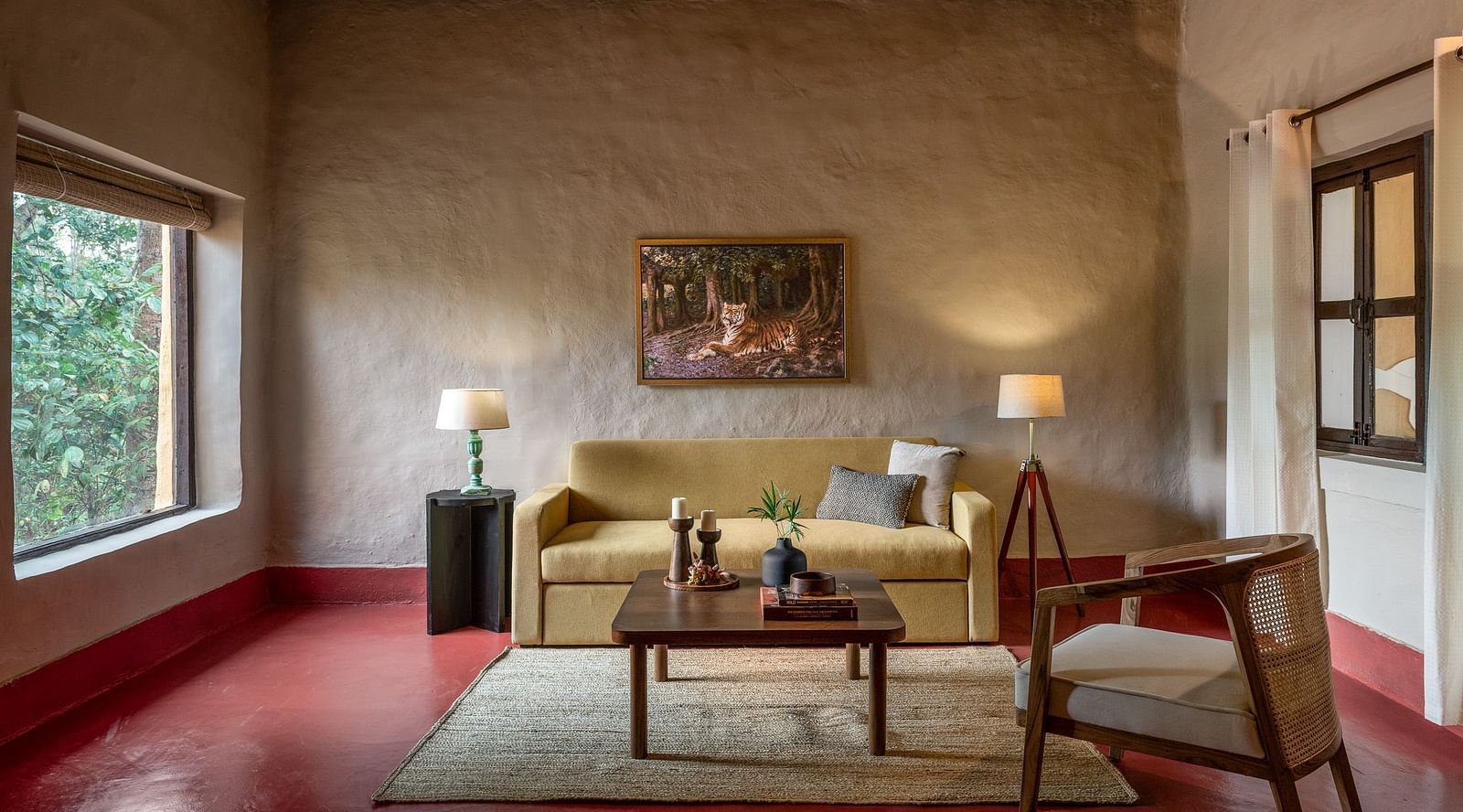 Front view of the sofa in Mud House Suite at Saccharum Safari Lodge, Balaghat