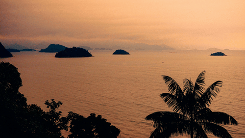 Tranquil tropical sunset over the beach at Sunrise Beach Resort Andaman.