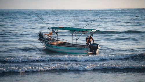 A man fishing on a boat