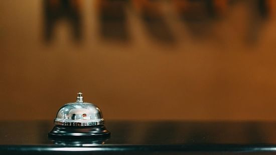 A reception bell designed for calling staff, placed on a desk