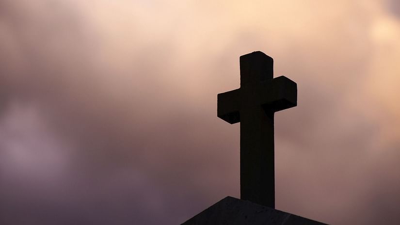 The Holy Cross amidst cloudy skies