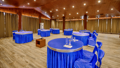 A spacious area with a round seating arrangement in the Conference Hall at Silver Sand Beach Resort, Havelock.