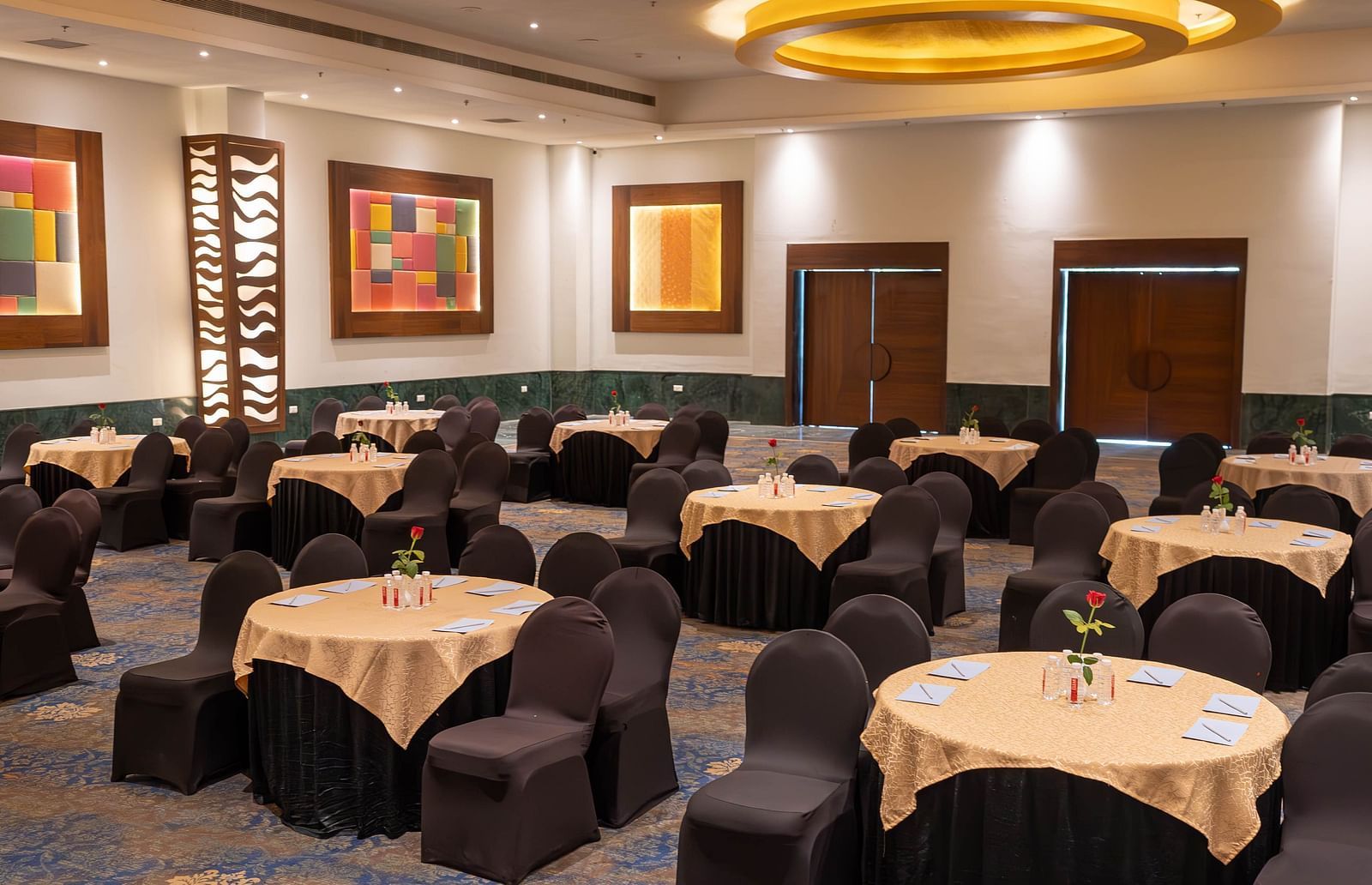 A room set up for an event with round tables with chairs - Bamboo Saa Resort & Spa, Udaipur