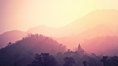 Image of mountains in various tints as the sun sets