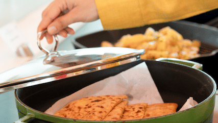 A person making chapatis