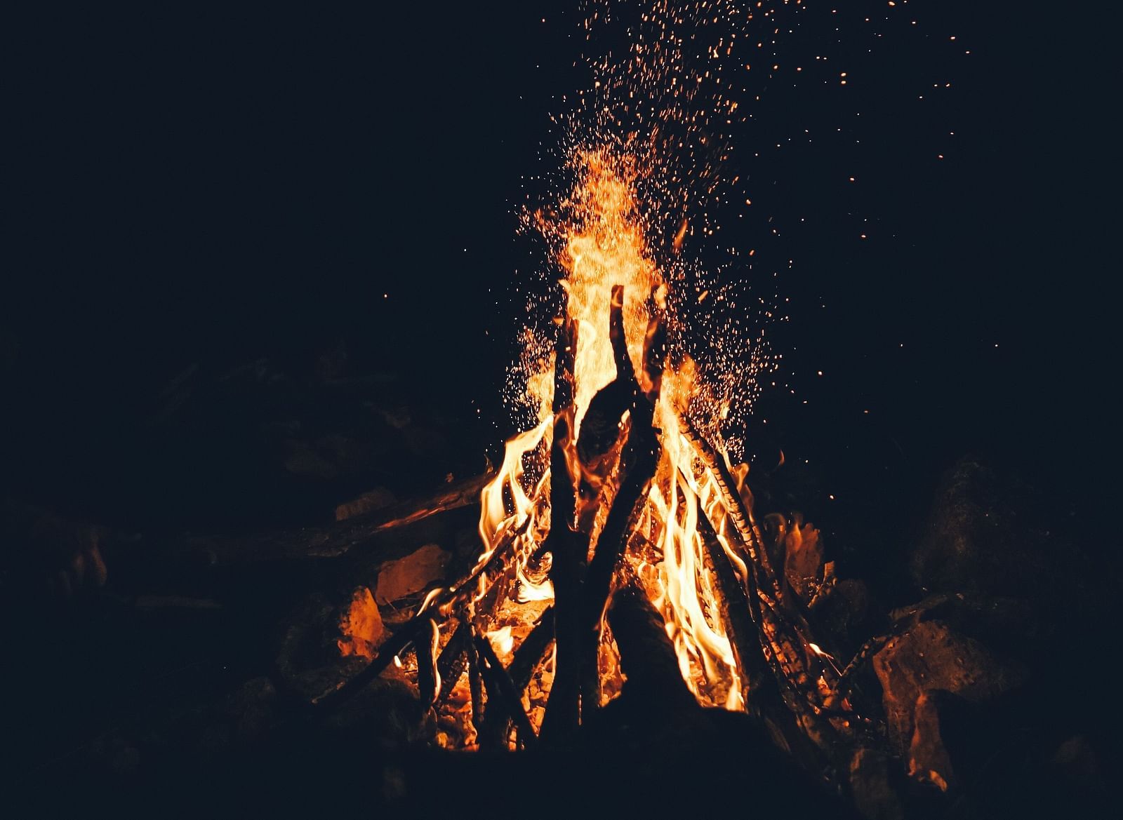 a bonfire burning at night