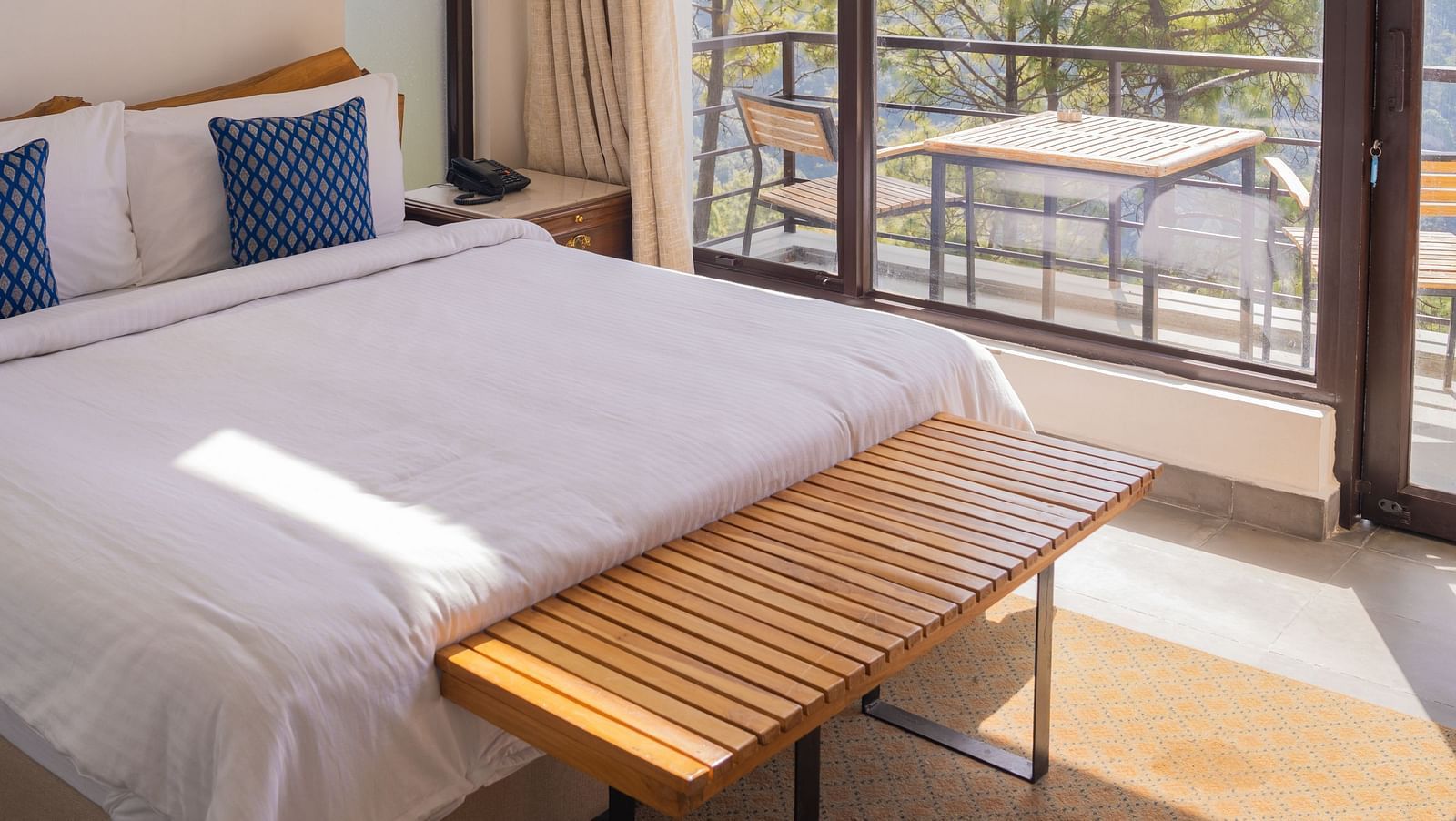 A bedroom featuring balcony at BluSalzz Escapade Resort, Lansdowne